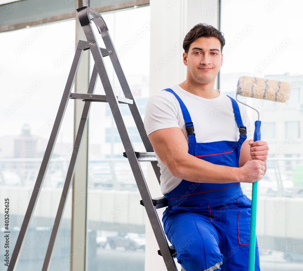 Painter repairman working at construction site Painter repairman working at construction site