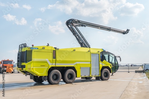 Yellow fire truck on the airport runway