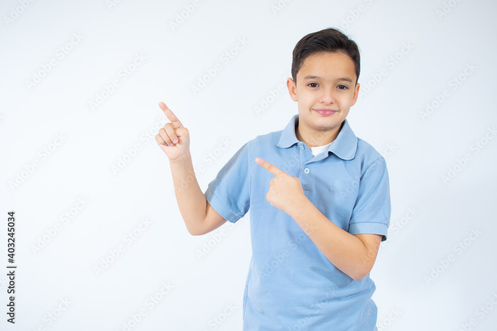 Portrait of cheerful boy with good idea - isolated over white background. 10 year old kid pointing finger up. Child points by finger upward. Cheerful boy shows something Portrait of cheerful boy with good idea - isolated over white background. 10 year old kid pointing finger up. Child points by finger upward. Cheerful boy shows something