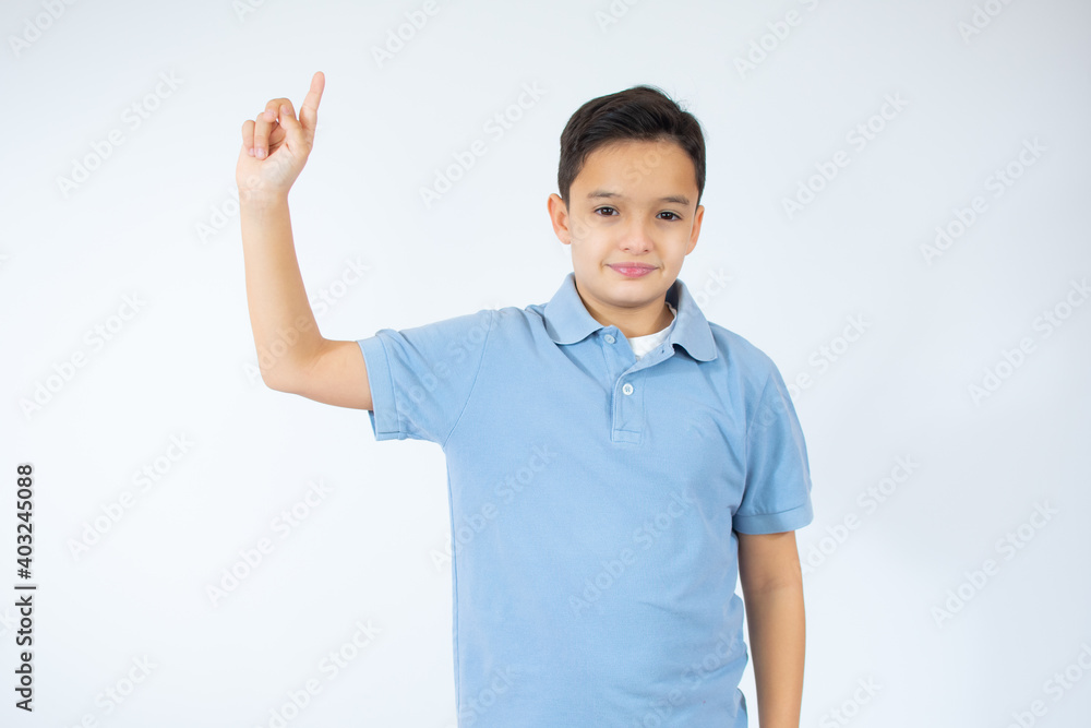 Portrait of cheerful boy with good idea - isolated over white background. 10 year old kid pointing finger up. Child points by finger upward. Cheerful boy shows something Portrait of cheerful boy with good idea - isolated over white background. 10 year old kid pointing finger up. Child points by finger upward. Cheerful boy shows something