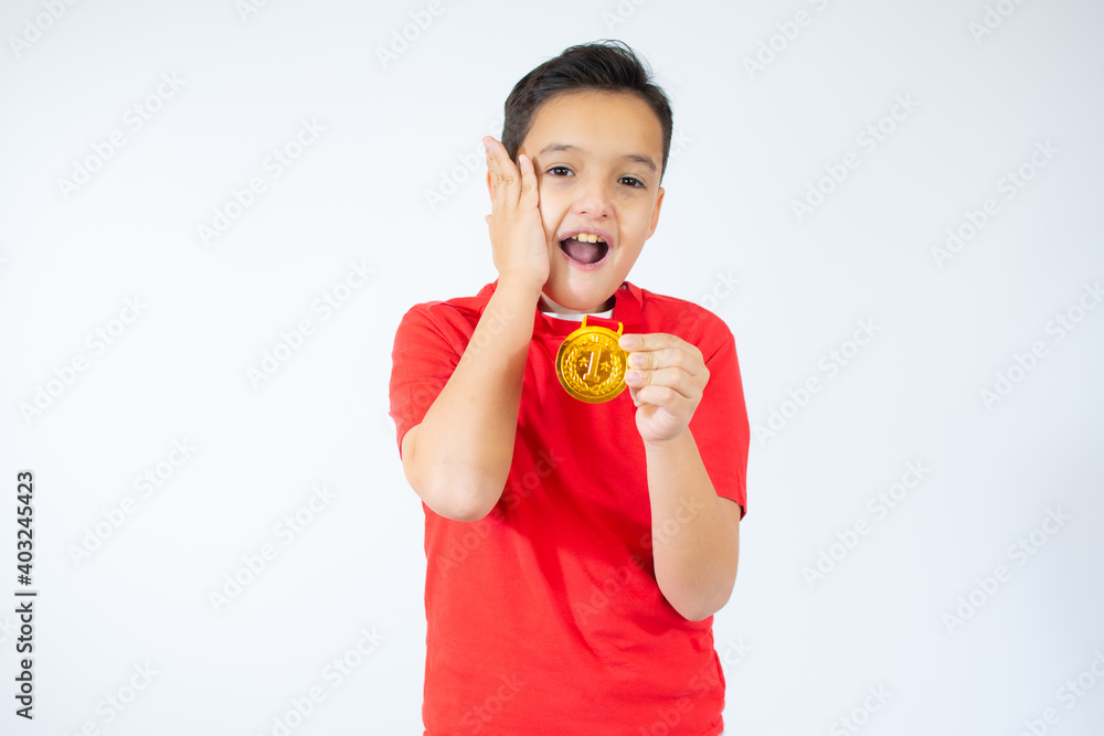 Happy expressive child i with medal isolated on white Happy expressive child i with medal isolated on white