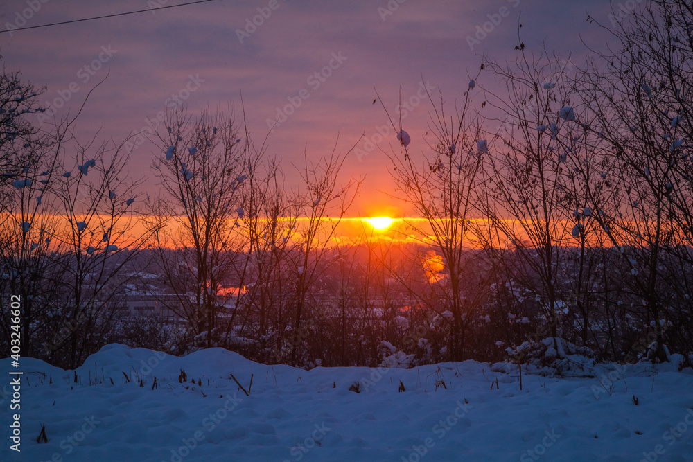 winter sunset in the city with snow winter sunset in the city with snow