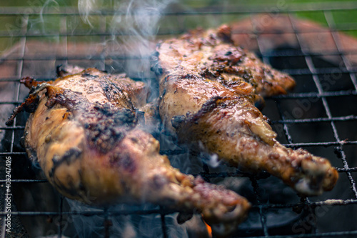 Chicken Legs Roasted On The Hot Flaming Charcoal Grill, Top View Close Up