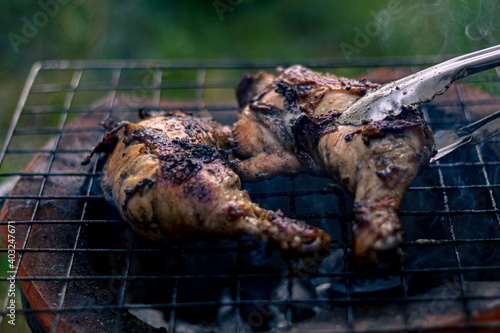 Chicken Legs Roasted On The Hot Flaming Charcoal Grill, Top View Close Up