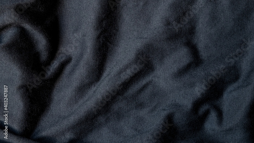 High resolution, detail shot of soft Black gray fabric background. Polyester and cotton clothing wallpaper with copy space for text.