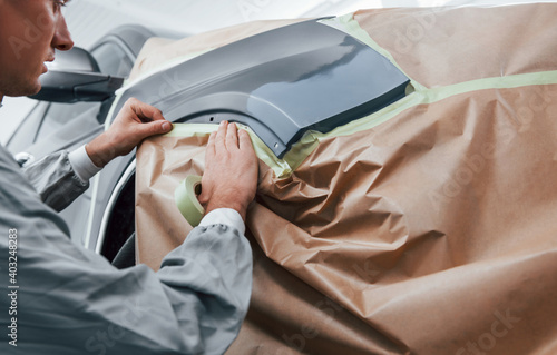 Obraz na plátně Covering car by brown cloth