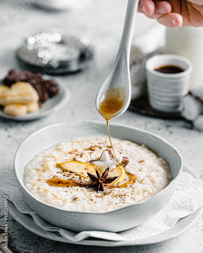 Rice porridge with maple sirup drizzle photo