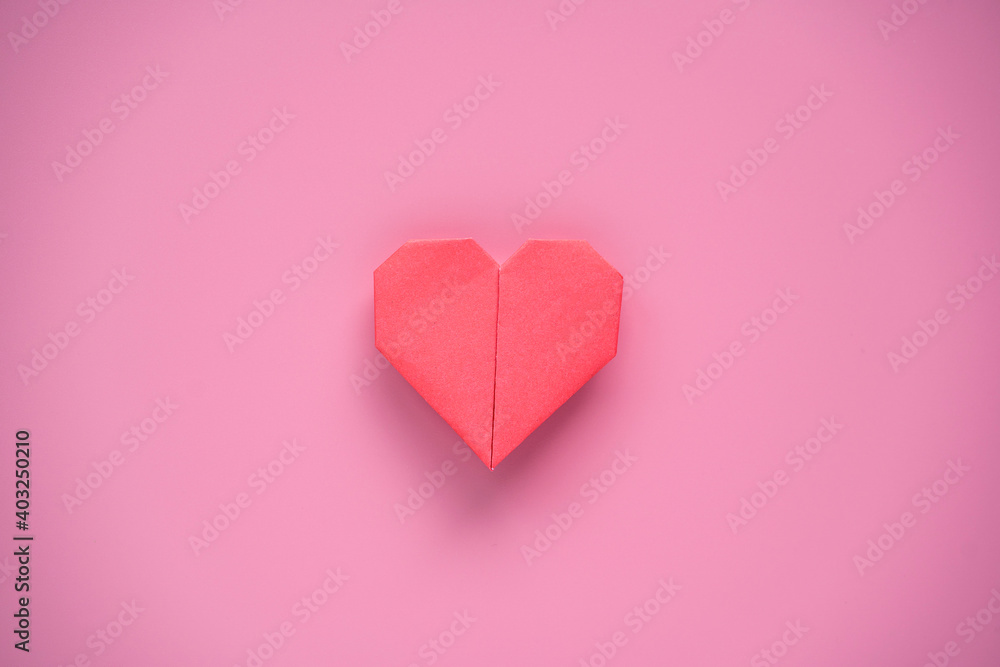 Valentine’s Day concept, Red heart on pink background.