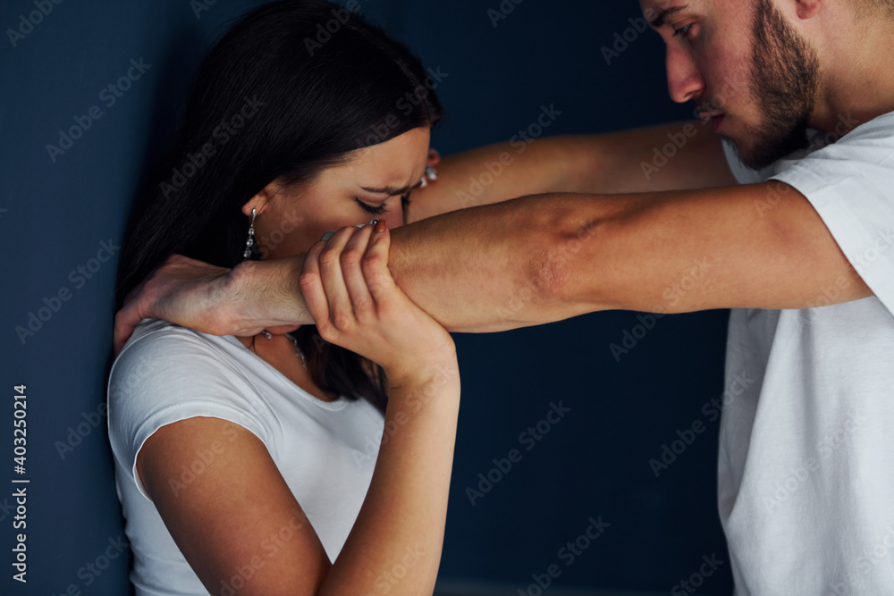 Violent aggressive young man beats his girlfriend at home Violent aggressive young man beats his girlfriend at home