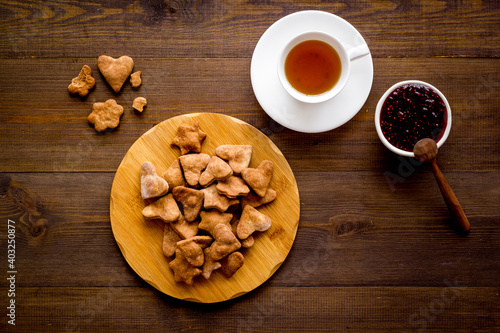 Breakfast with cookies berry jam and tea