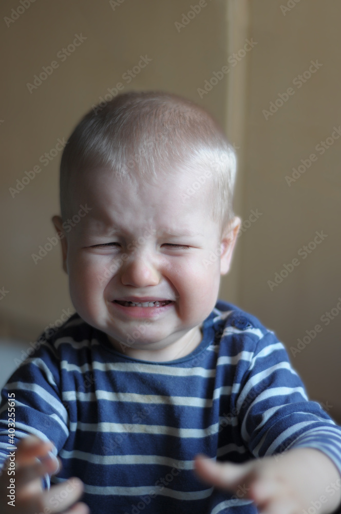 children's emotions - resentment on the face of a little boy children's emotions - resentment on the face of a little boy