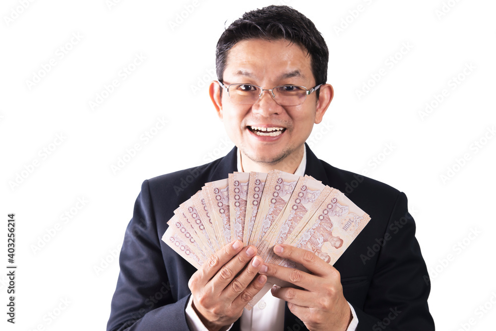 Thai business man happy holding Thai baht note money - people with business success concept Thai business man happy holding Thai baht note money - people with business success concept