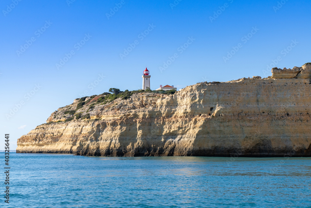 view of the Alfanzina lighthouse on the beautiful Algarve coast of Portugal