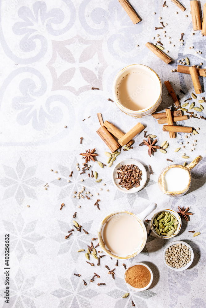 Masala chai served with cinnamon sticks Masala chai served with cinnamon sticks