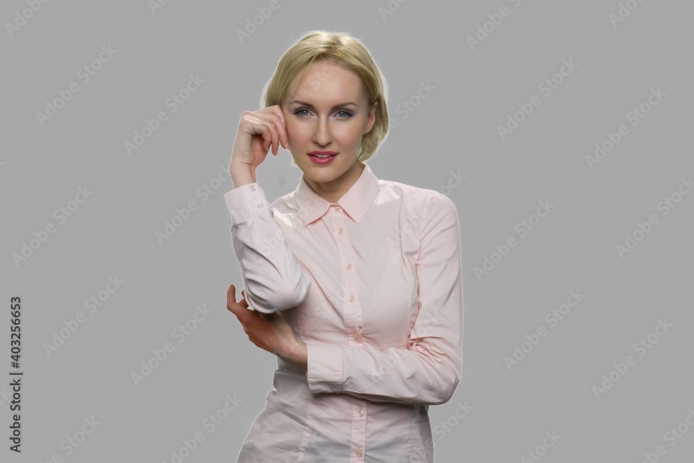 Seductive young business woman looking at camera. Front view of beautiful sexy woman posing in studio. Seductive young business woman looking at camera. Front view of beautiful sexy woman posing in studio.