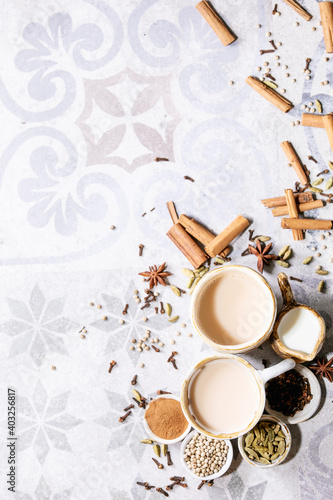 Masala chai served with cinnamon sticks