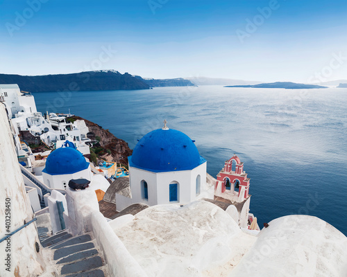 Greek Orthodox church of St. Nicholas on the background waters of the Aegean sea in Oia town on Santorini island in Greece