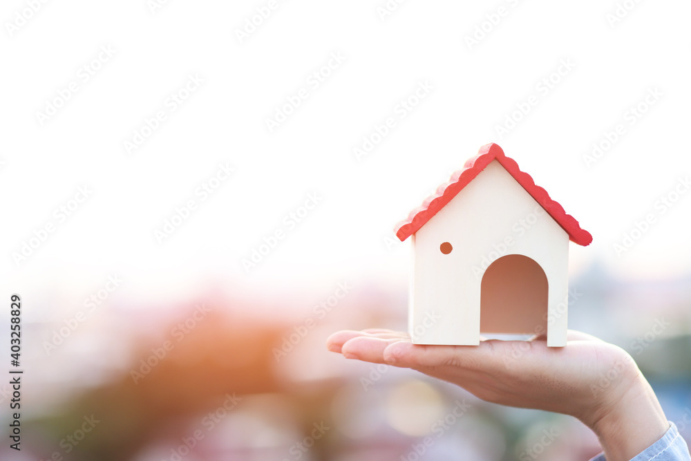 House in hand financial insurance and saving money concept House in hand financial insurance and saving money concept