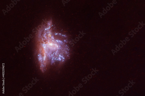 A blue galaxy with stars and nebulae. Elements of this image were furnished by NASA.