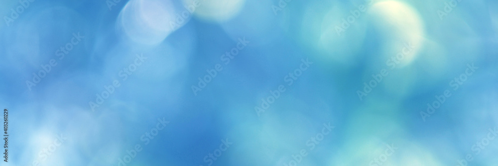 Fototapeta premium Light blue Leaf background. Blurred leaves and circular bokeh. Abstract for design and wallpaper.