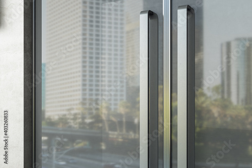 Glass doors with kind of modern office building.