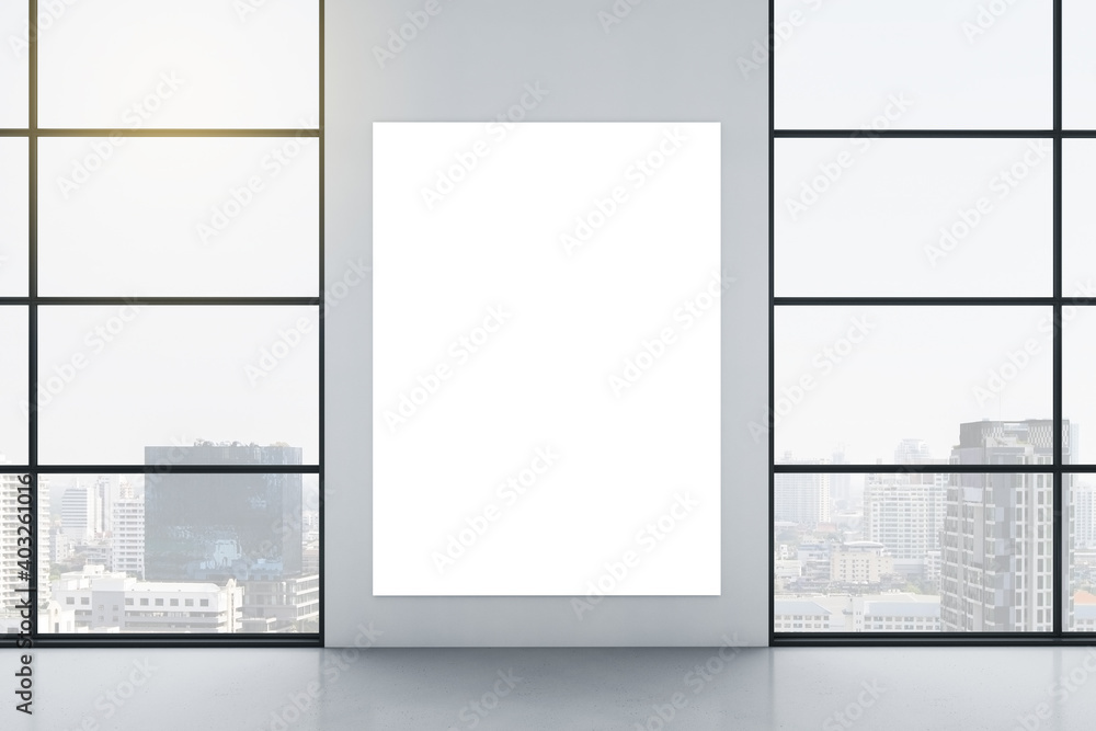 Gallery interior with empty poster on wall and city view Gallery interior with empty poster on wall and city view