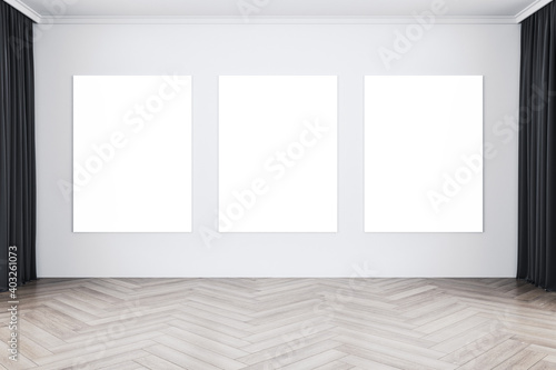 Minimalistic gallery interior with curtain and three blank posters