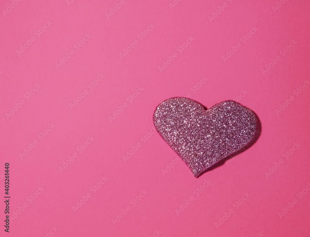 Pink shiny heart for valentine's day isolated on pink background. Glitter and sparkles hearts. Expensive ornate banner. Valentine's day background