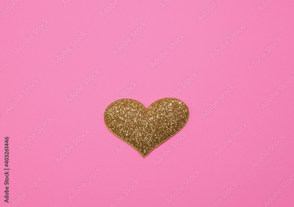 Gold glittering heart for valentine's day isolated on pink background. Glitter and sparkles hearts. Expensive ornate banner. Valentines day background