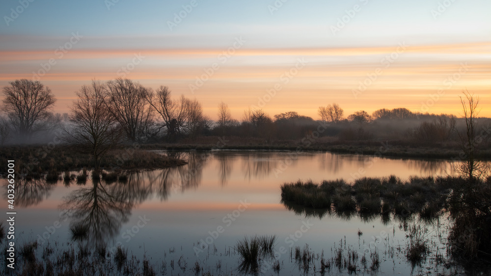 Winter sunrise over river