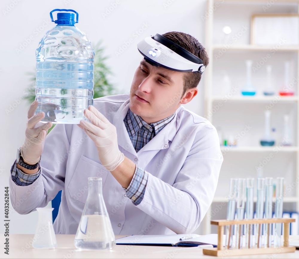 Young chemist student experimenting in lab Young chemist student experimenting in lab