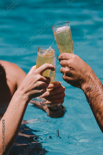Toasting at a pool party