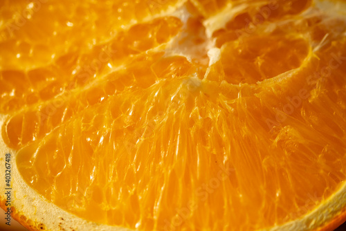 Slice of sliced orange close-up. The concept of tasty and healthy food