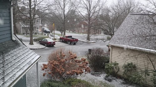 Wallpaper Mural Snow falls in a quiet suburban neighborhood in a lush forested area in North America. 4k and 60fps Torontodigital.ca