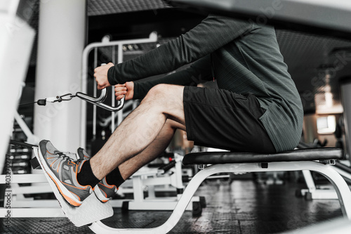 Portrait of male legs performing exercise in the gym © Тарас Нагирняк