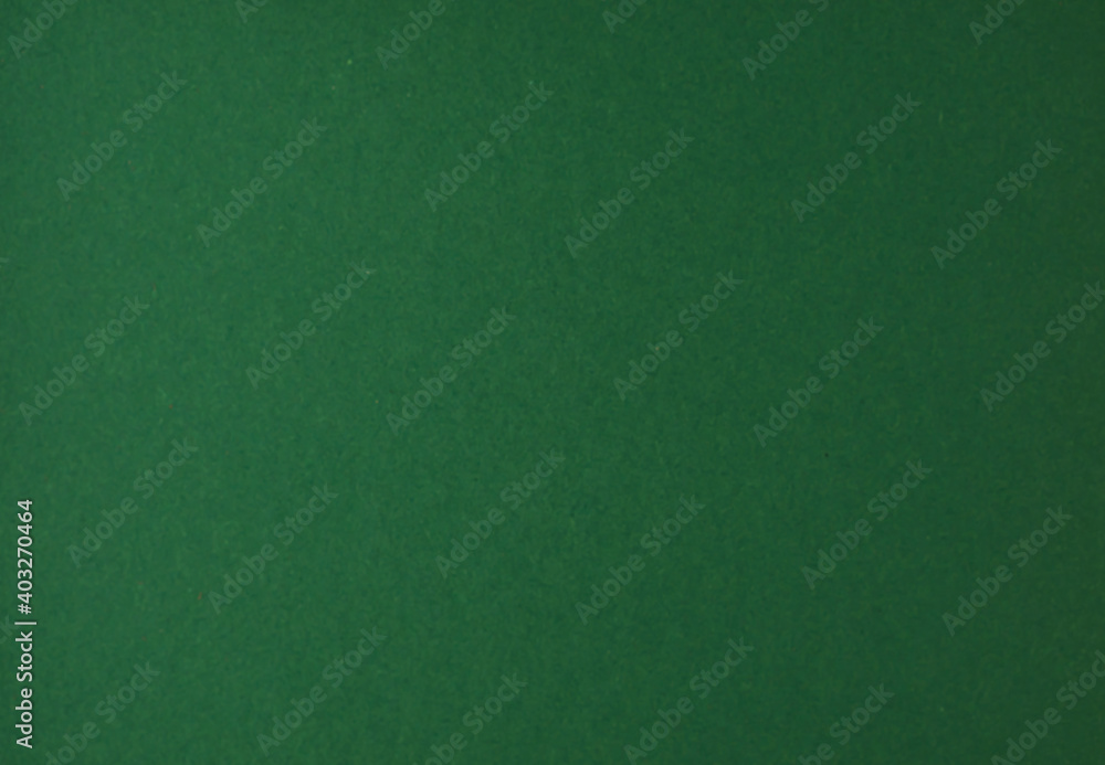Blurred green kraft paper texture. Blurred green kraft paper texture.