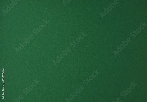 Blurred green kraft paper texture.