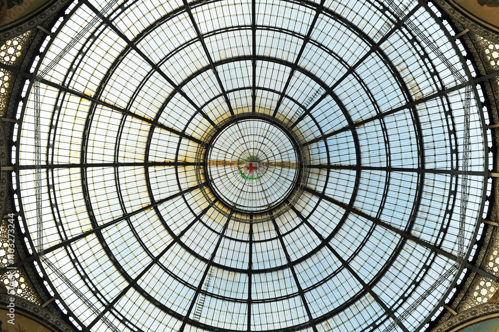 Glass dome of the gallery - Galleria Vittorio Emanuele II in Milan, Lombardy, Italy. Built between 1865 and 1877, it is an active shopping center for major fashion brands.