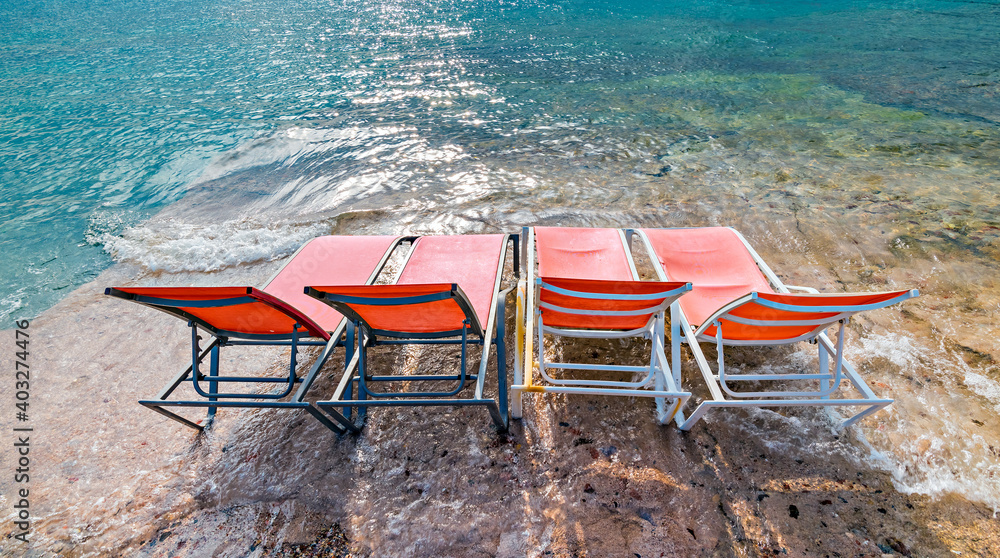 Serene day a public beach of Eilat - number one tourist resort and recreational city in Israel located on the Red Sea Serene day a public beach of Eilat - number one tourist resort and recreational city in Israel located on the Red Sea