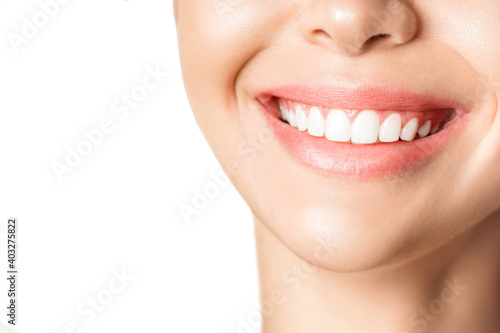 Beautiful young woman with healthy teeth on white background.