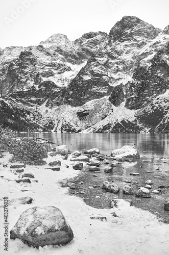 Fototapeta Naklejka Na Ścianę i Meble -  Black and white picture of frozen mountain lake.