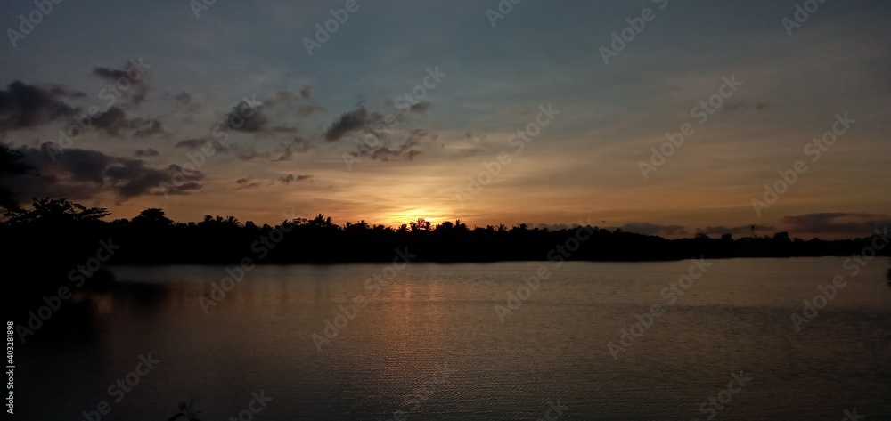 Fototapeta premium sunset over the river