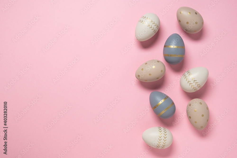 Easter concept. decorated eggs stand in a row on pink background. Minimal easter concept. Happy Easter card with copy space for text. Top view, flatlay