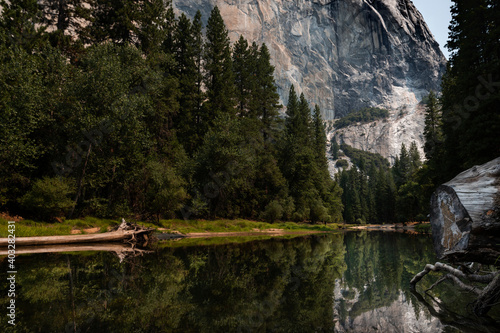 Photography Scenic view of the merced river in the Yosemite valley, with the rocky mountains reflected on the water, in California, USA