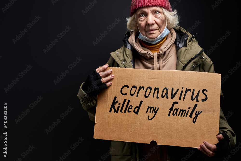 homeless woman has no family due to coronavirus, she needs help and food donation, isolated on black background homeless woman has no family due to coronavirus, she needs help and food donation, isolated on black background