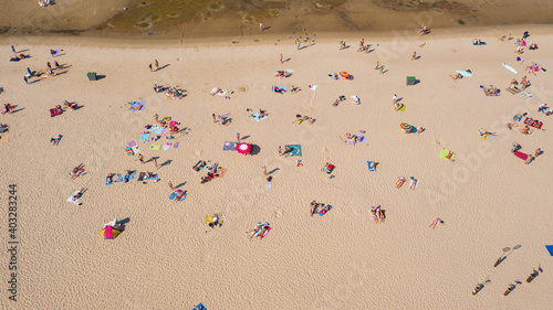 Dzintari, Jurmala ,Latvia, Baltics. Aerial view photo from flying drone panoramic to Dzintari sandy beach full of people sunbathing and swimming in the Baltic Sea on a hot and sunny summer day. (Serie