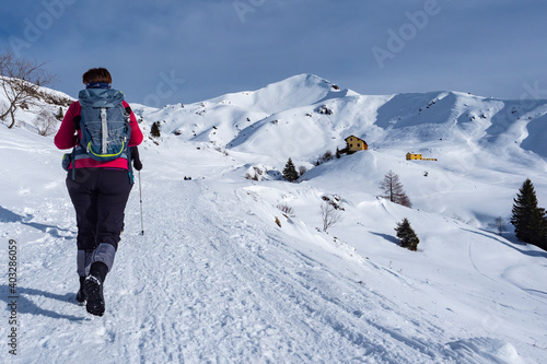 Hiking scene in winter on the alps