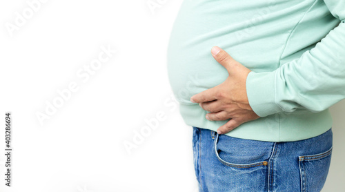 Fat man suffering from stomach pain, ulcer discomfort or metabolic disorder