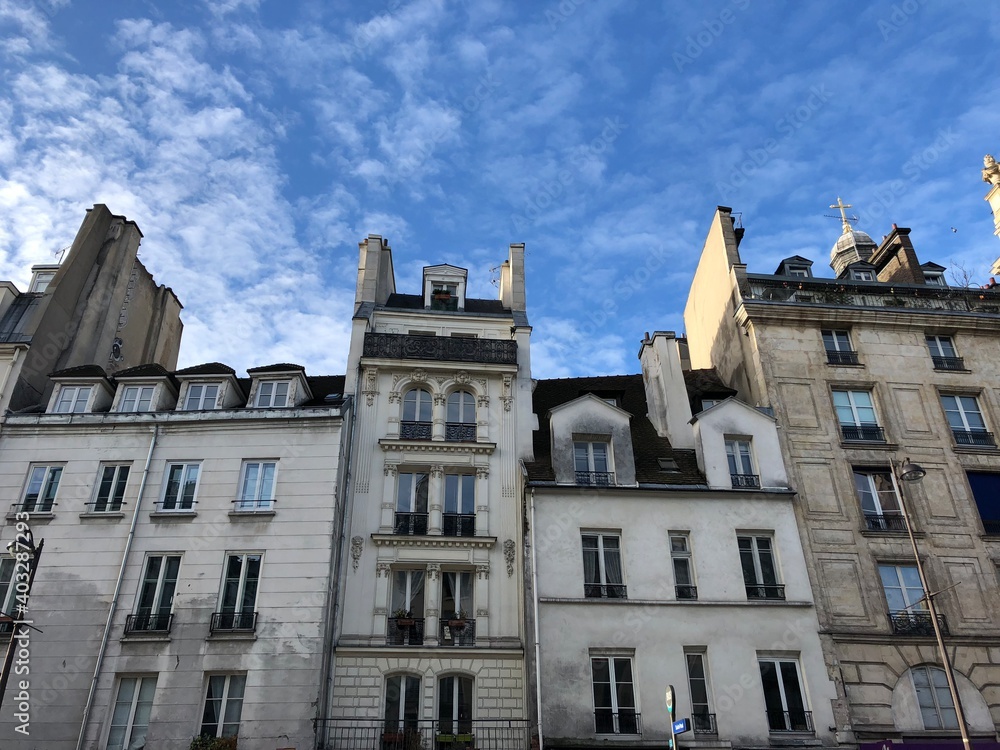 Parisian buildings against a blue sky