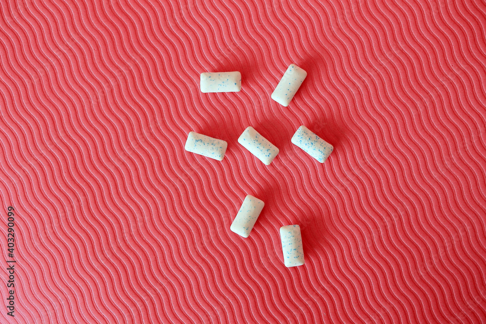 Chewing gum on pink background Chewing gum on pink background